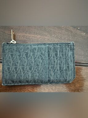 Saint Laurent Fragment Card Case. Signature logo design. Zipper pocket for cash